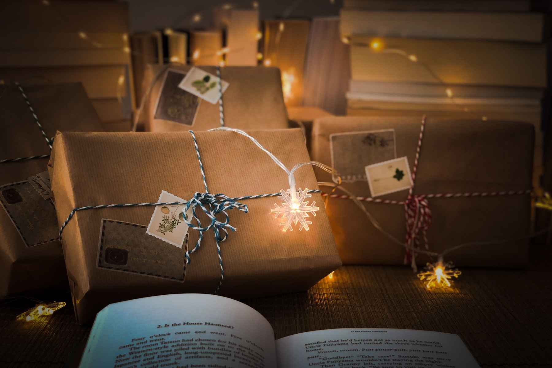 wrapped gifts kraft paper table string lights